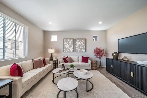 a view of a dining room with furniture window and wooden floor