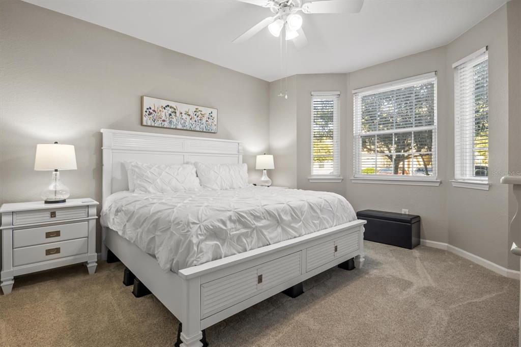 301 Terrace Ridge Circle, Unit 301 Davenport, FL 33896 - Photo 11 of 35 a bedroom with a bed and a window