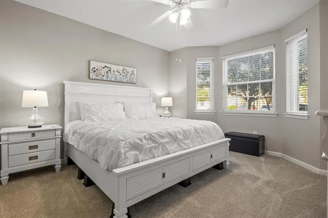 a bedroom with a bed and a night stand