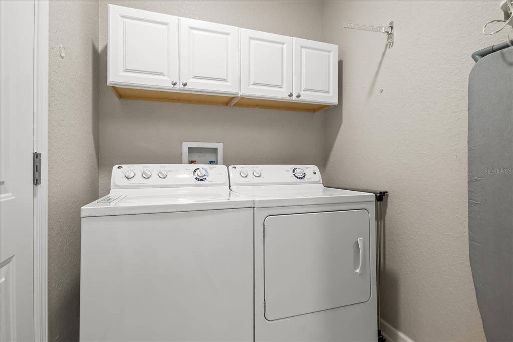 301 Terrace Ridge Circle, Unit 301 Davenport, FL 33896 - Photo 21 of 35 a utility room with dryer and washer