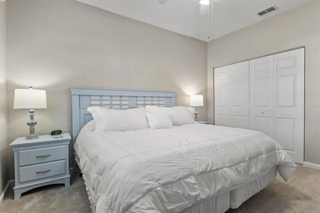 a living room with couch and a floor to ceiling window