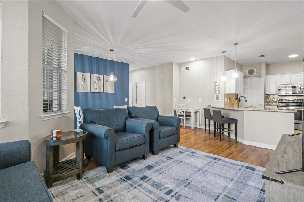 301 Terrace Ridge Circle, Unit 301 Davenport, FL 33896 - Photo 10 of 35 a living room with furniture and a large window