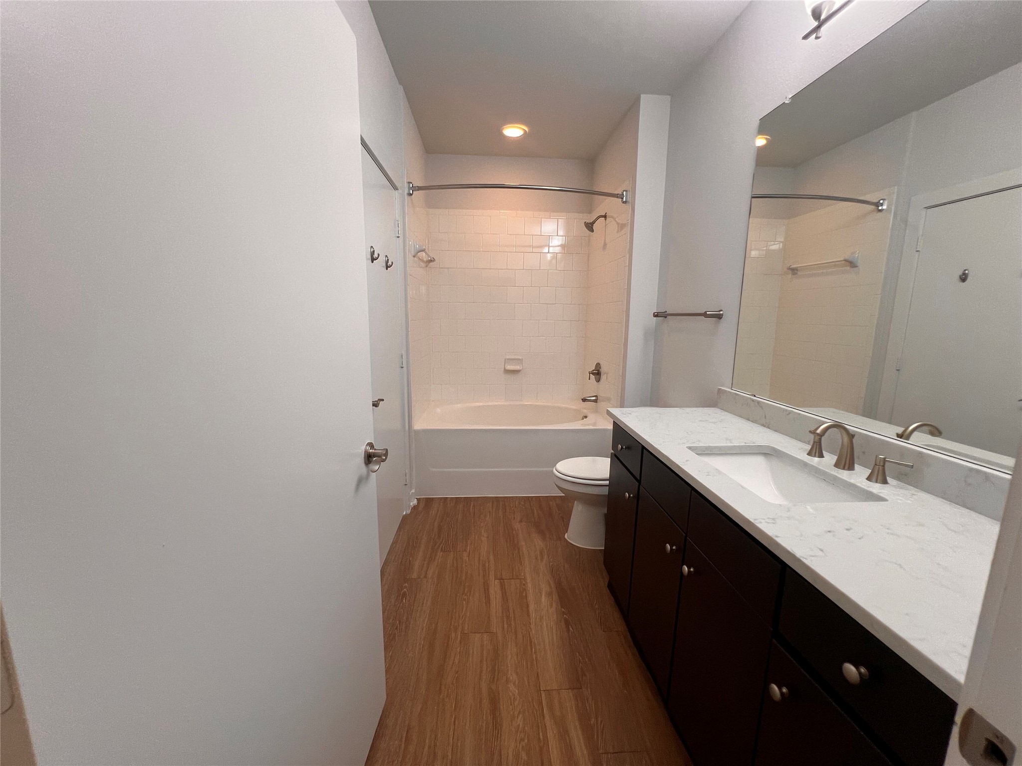 1900 Barton Springs Road, Unit 4041 Austin, TX 78704 - Photo 20 of 35 a spacious bathroom with a granite countertop sink a toilet and shower
