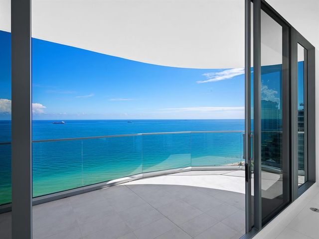 a view of swimming pool with outdoor seating