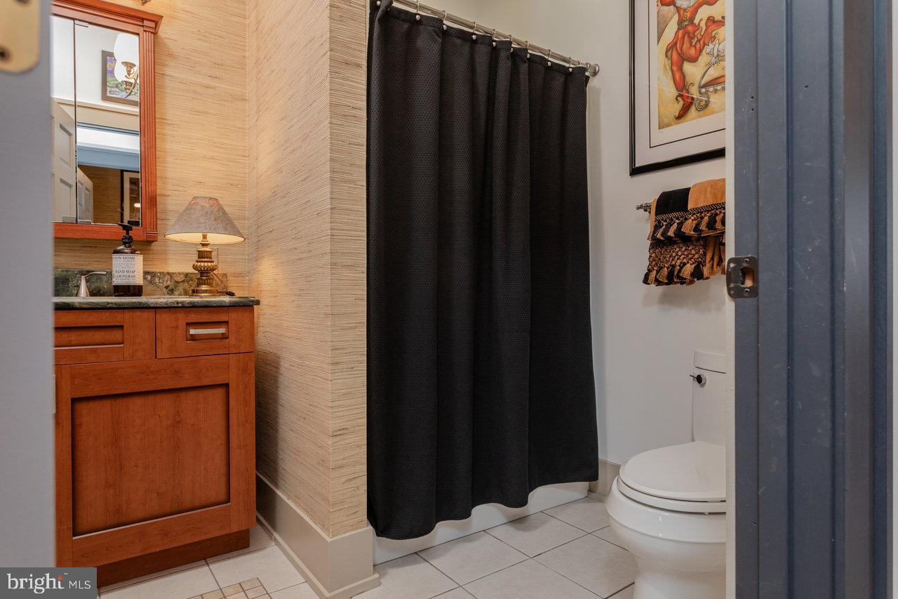 1934 Quicksburg Road Quicksburg, VA 22847 - Photo 42 of 103 a bathroom with a toilet a sink and shower