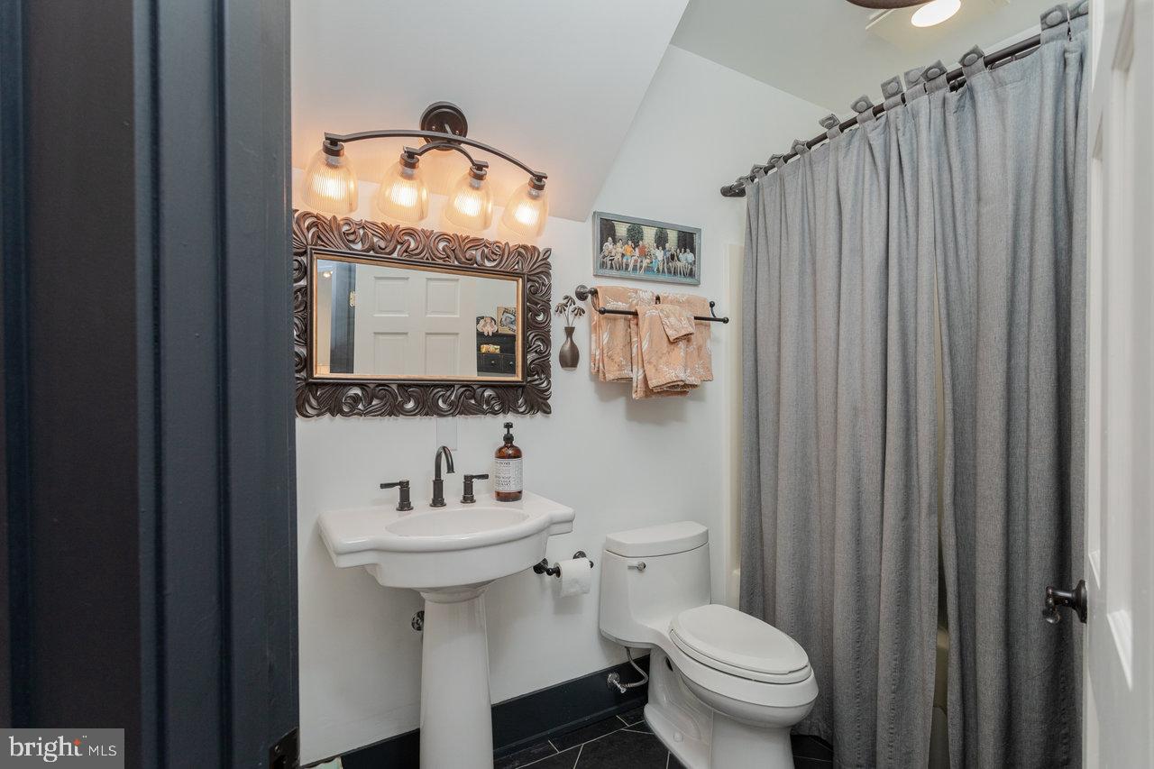 1934 Quicksburg Road Quicksburg, VA 22847 - Photo 67 of 103 a bathroom with a sink toilet and a mirror