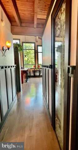 a kitchen with stainless steel appliances kitchen island granite countertop a refrigerator a stove and a microwave oven