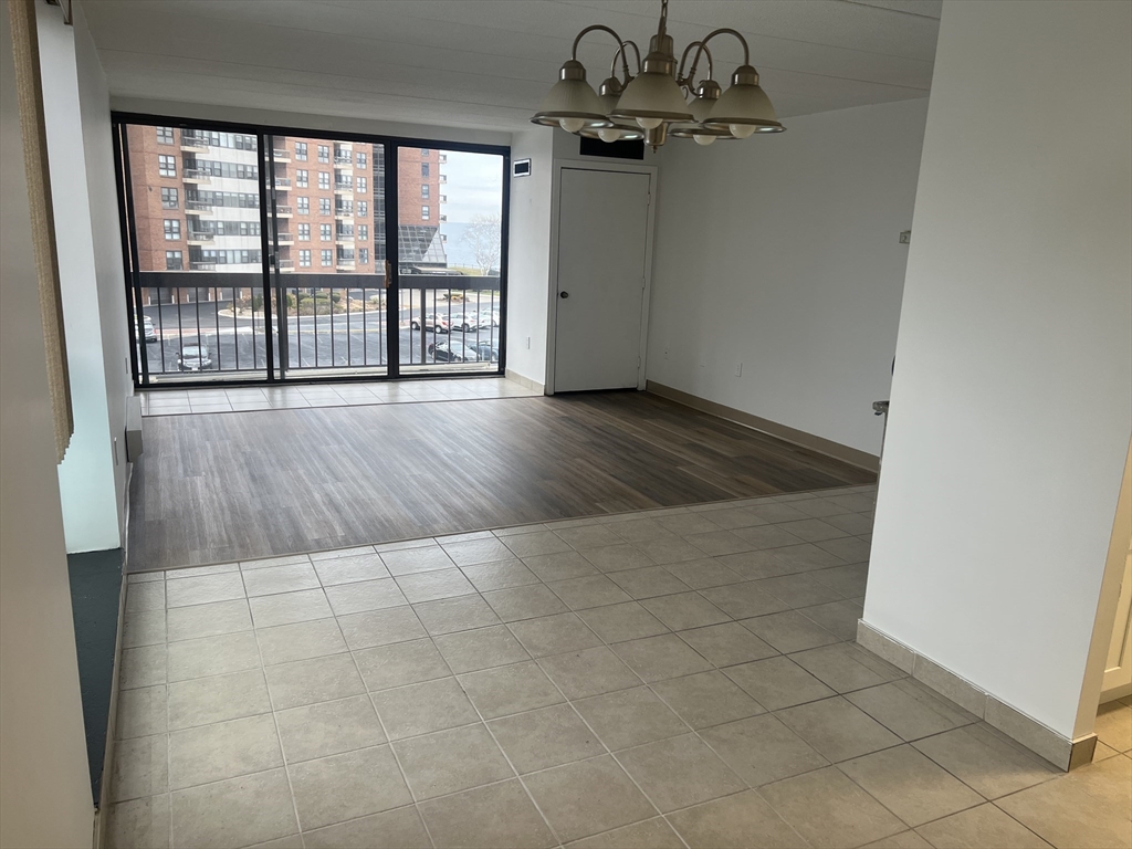 1 Pond Street, Unit 4N Winthrop, MA 02152 - Photo 2 of 13 an empty room with windows