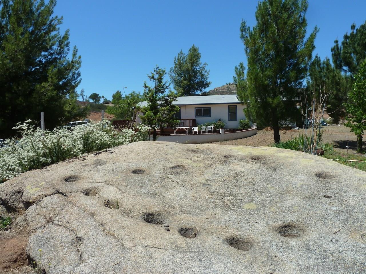 1510 Peutz Valley Road Alpine, CA 91901 - Photo 14 of 24 Ancient indian grinding holes, or morteres, are visible in this large boulder. Others are present higher up the hillside.
