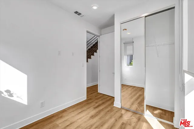 a view of entryway with wooden floor