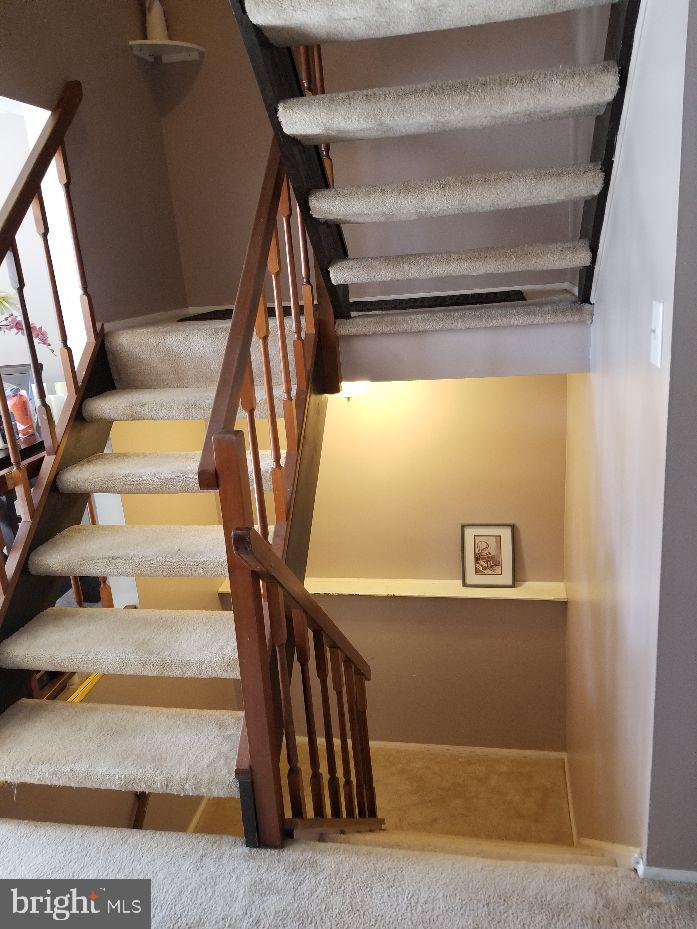 1788 Springfield Lane Frederick, MD 21702 - Photo 14 of 15 Living room open staircase up and down.