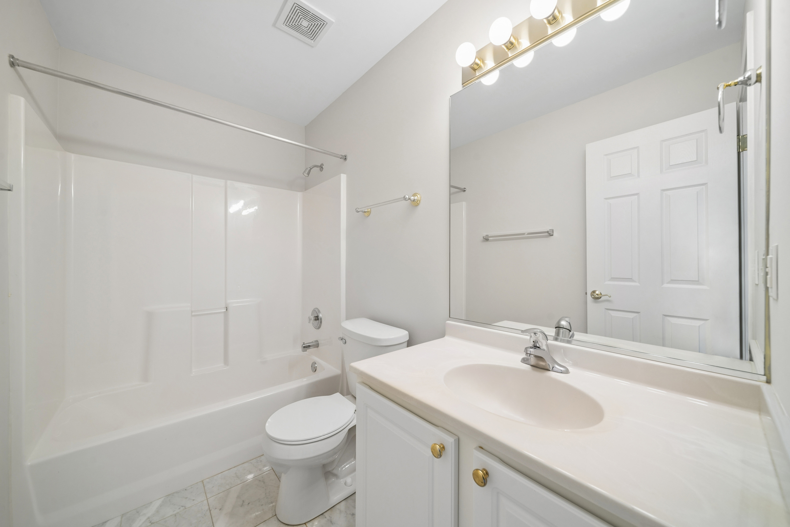 233 Spring Court North Aurora, IL 60542 - Photo 17 of 18 a bathroom with a sink toilet mirror and shower