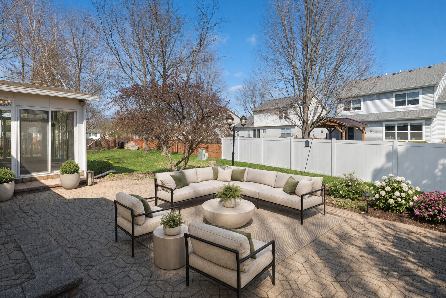 233 Spring Court North Aurora, IL 60542 - Photo 10 of 18 a view of a patio with couches and table and chairs and potted plants