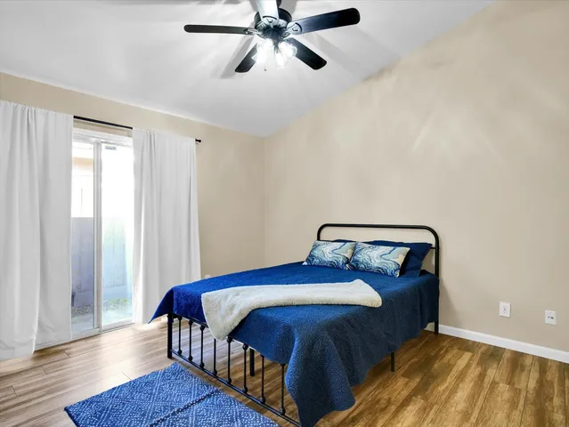 a bedroom with bed and window