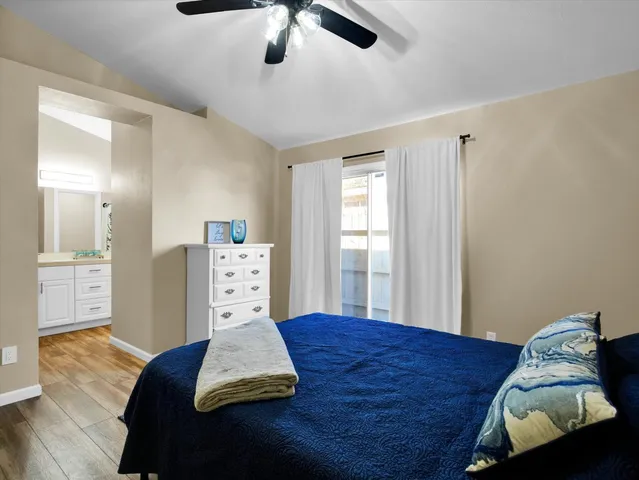 a bed room with furniture and window