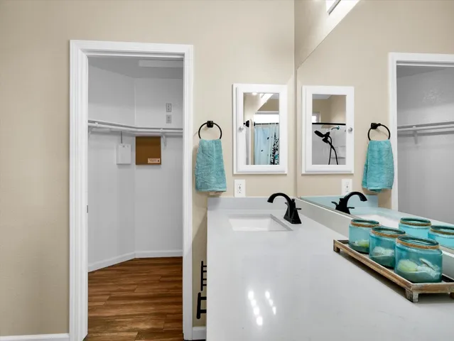 wooden floor to ceiling window and a mirror