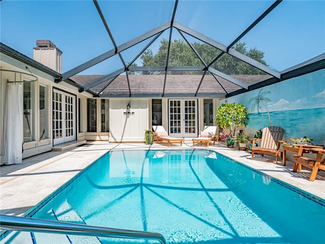 a view of a backyard with a patio and wooden tub
