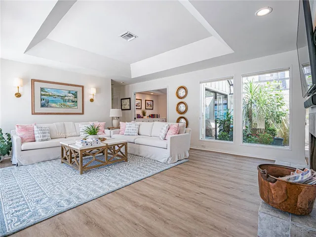 a living room with furniture and windows