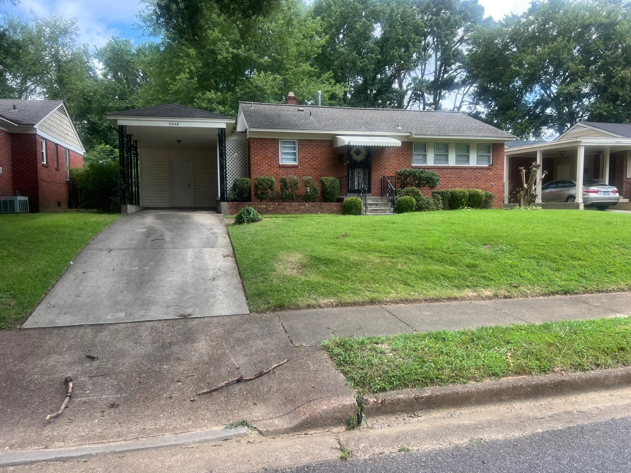 5048 Kaye Road Memphis, TN 38117 - Photo 15 of 19 front view of a house and a yard