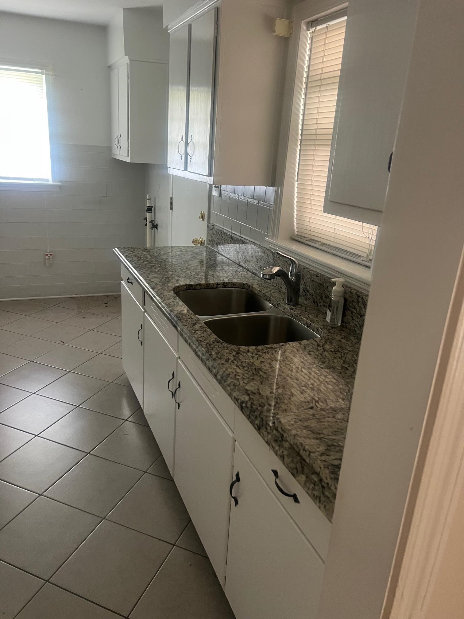 5048 Kaye Road Memphis, TN 38117 - Photo 7 of 19 a kitchen with a sink and cabinets