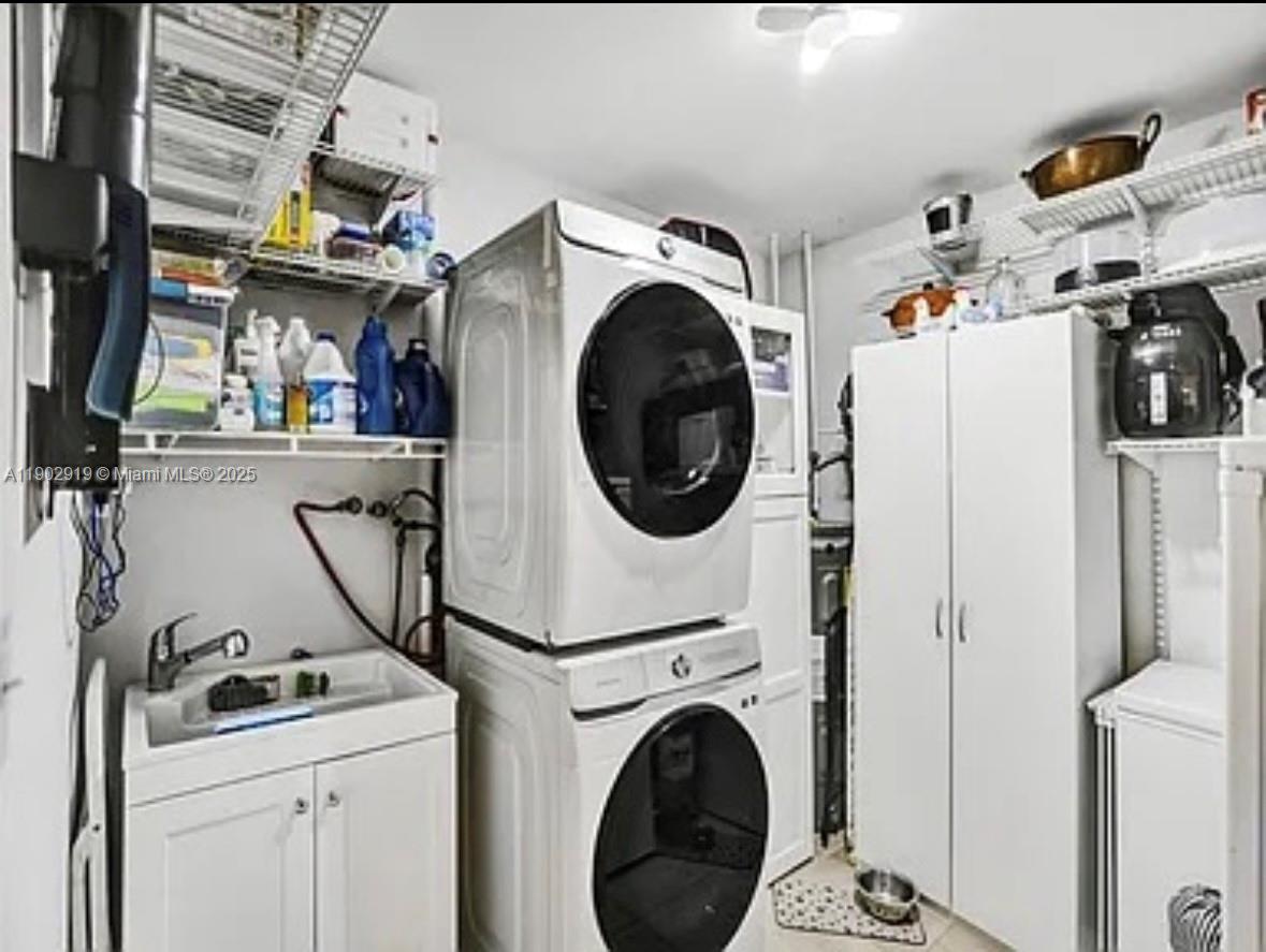 37225 Southwest 214th Avenue Homestead, FL 33034 - Photo 17 of 75 a utility room with dryer and washer
