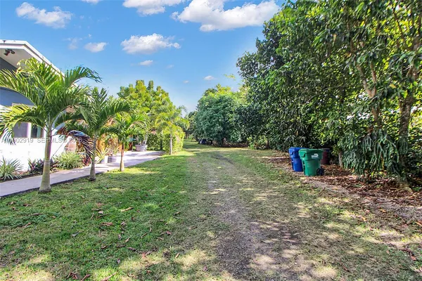 a backyard of a house with lots of green space