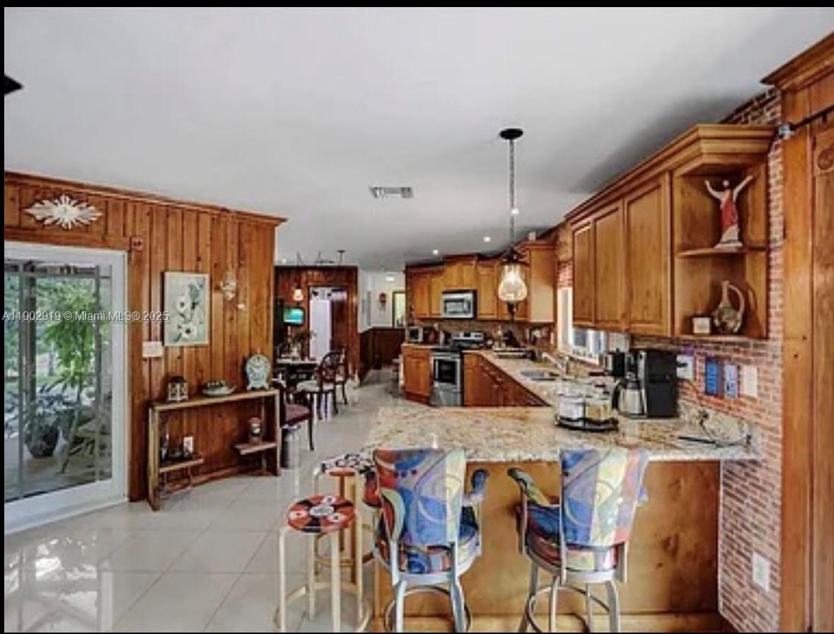 37225 Southwest 214th Avenue Homestead, FL 33034 - Photo 39 of 75 a view of a dining room with furniture window and outside view