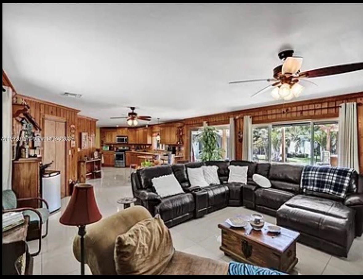 37225 Southwest 214th Avenue Homestead, FL 33034 - Photo 43 of 75 a living room with furniture and a large window