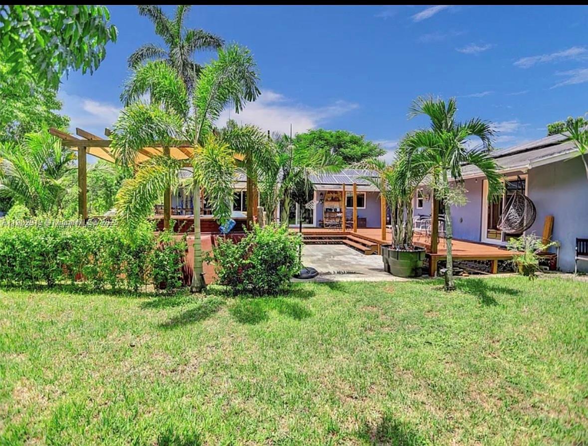 37225 Southwest 214th Avenue Homestead, FL 33034 - Photo 45 of 75 a house with a tree in front of it