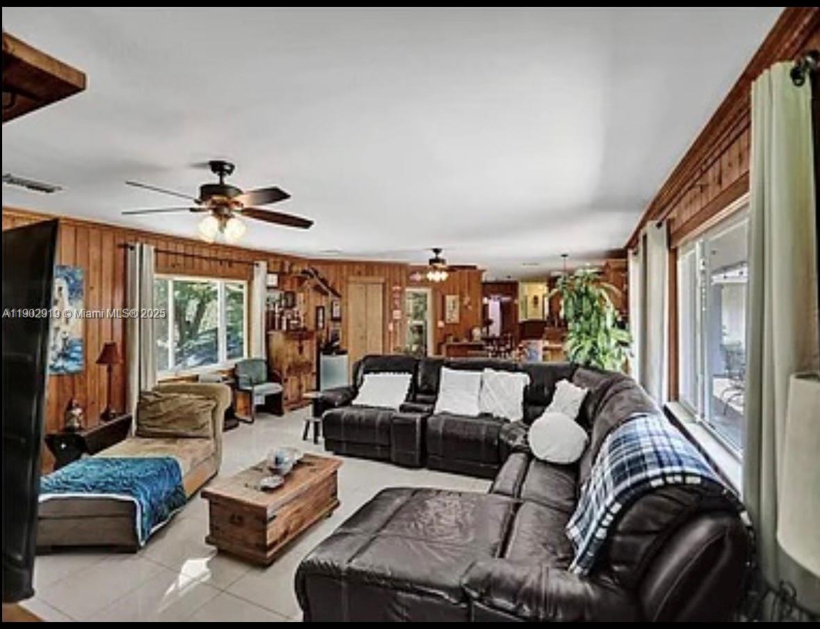 37225 Southwest 214th Avenue Homestead, FL 33034 - Photo 47 of 75 a living room with furniture and a large window