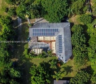 37225 Southwest 214th Avenue Homestead, FL 33034 - Photo 50 of 75 a front view of a house with a yard