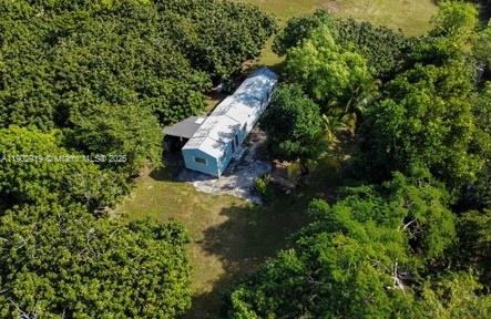 37225 Southwest 214th Avenue Homestead, FL 33034 - Photo 57 of 75 a aerial view of a house with a yard