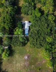 37225 Southwest 214th Avenue Homestead, FL 33034 - Photo 63 of 75 a view of a house with a yard