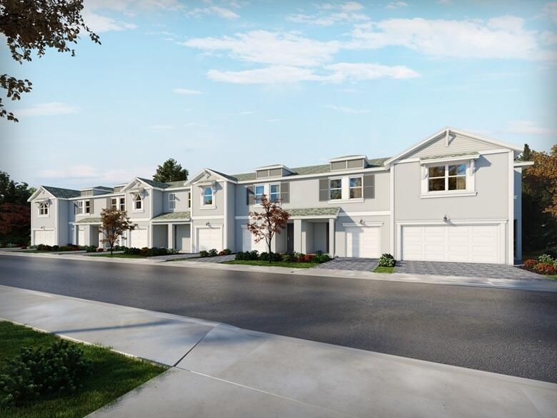5700 Southeast Edgewater Circle Stuart, FL 34997 - Photo 1 of 9 a front view of residential houses with street