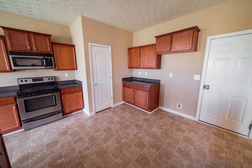 45 Apache Trail Fort Mitchell, AL 36856 - Photo 13 of 43 a view of kitchen with a sink and a stove top oven