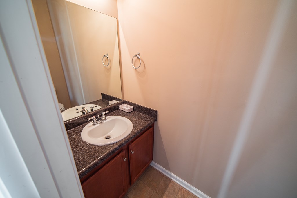 45 Apache Trail Fort Mitchell, AL 36856 - Photo 16 of 43 a bathroom with a sink and a mirror