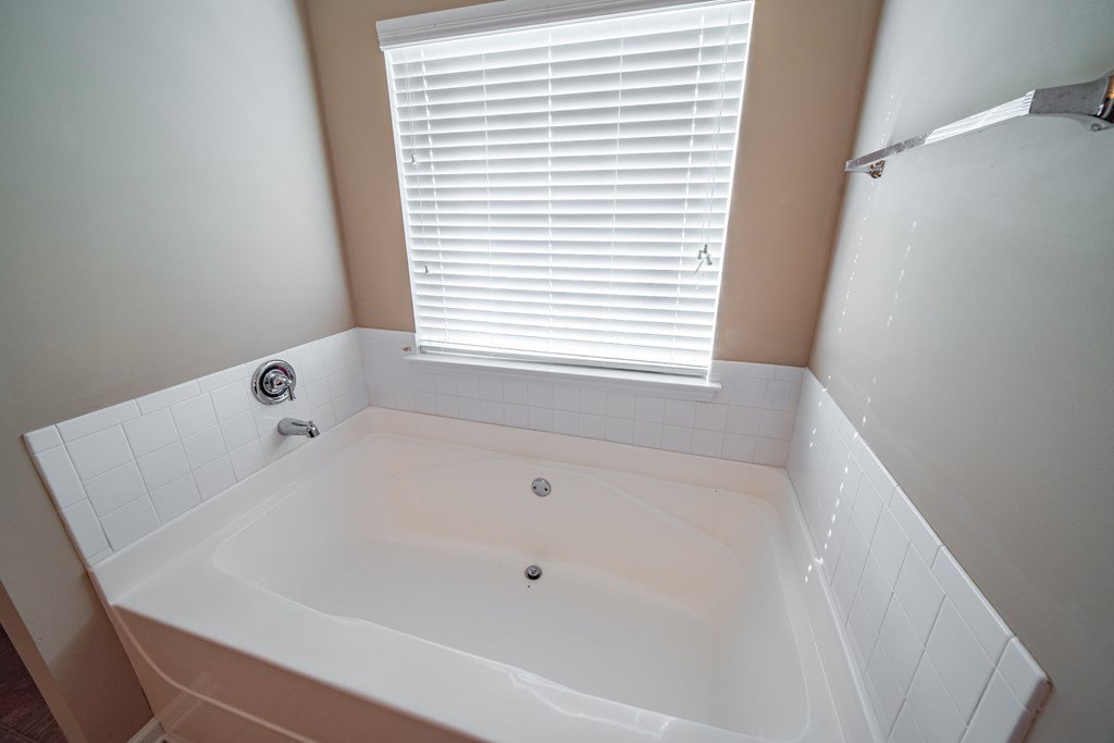 45 Apache Trail Fort Mitchell, AL 36856 - Photo 22 of 43 a white bath tub sitting in a bathroom