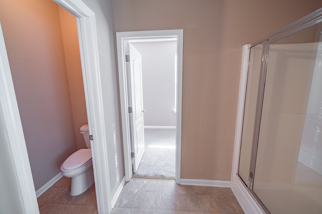 45 Apache Trail Fort Mitchell, AL 36856 - Photo 23 of 43 a bathroom with a tub and a toilet