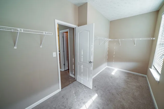 a view of bathroom with a tub and shower
