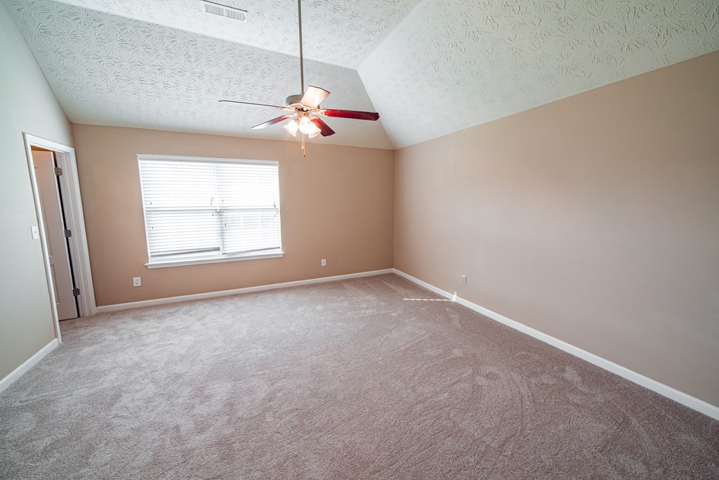 45 Apache Trail Fort Mitchell, AL 36856 - Photo 28 of 43 an empty room with windows and ceiling fan
