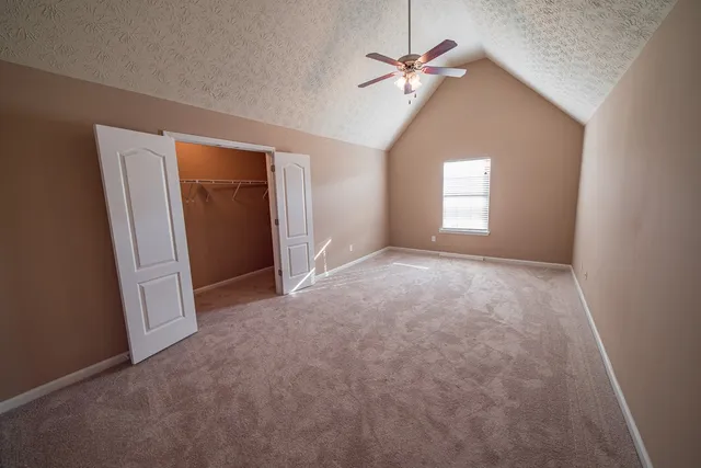 a view of a big room with carpet