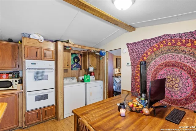 a room with furniture a flat screen tv and a fireplace