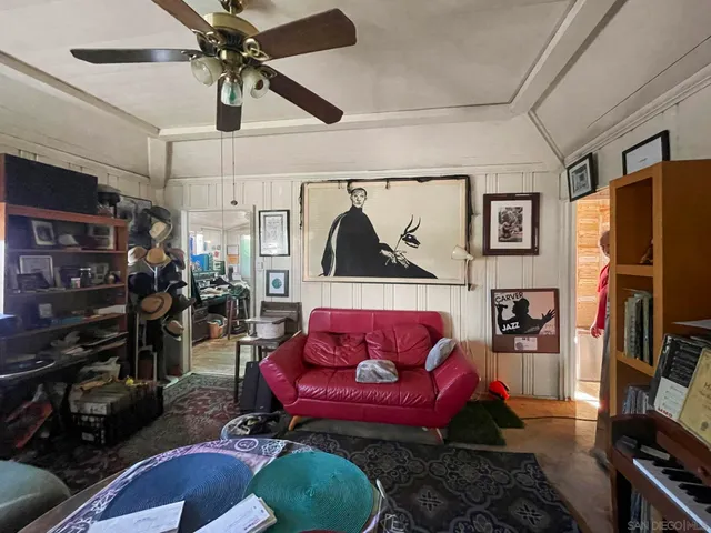 a view of a kitchen with fridge and workspace