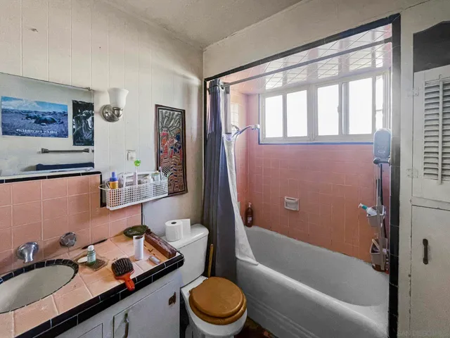 a kitchen with stainless steel appliances a stove a sink and a refrigerator