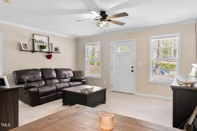a living room with furniture and a window