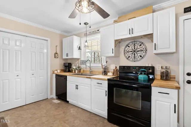 a kitchen with stainless steel appliances a stove and cabinets