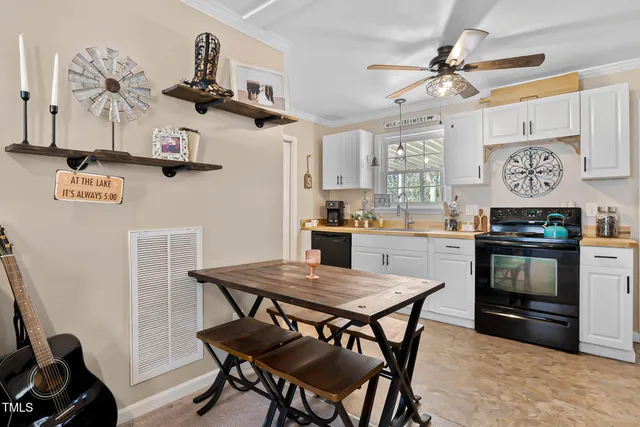 a kitchen with a table and chairs in it