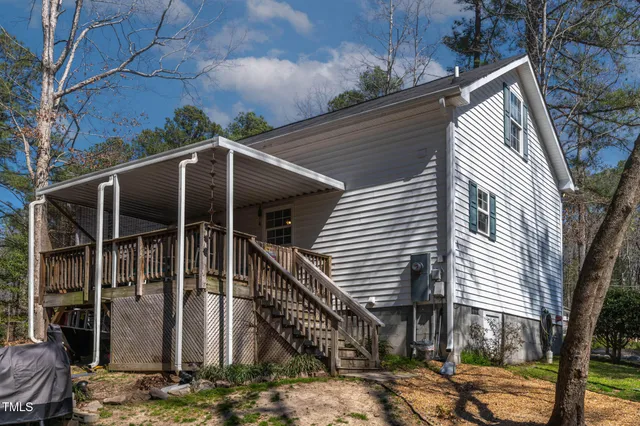 a front view of a house with parking space