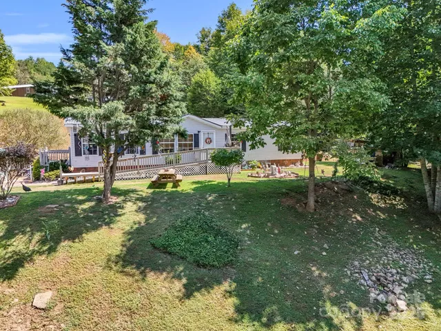 a aerial view of a house with a garden and trees