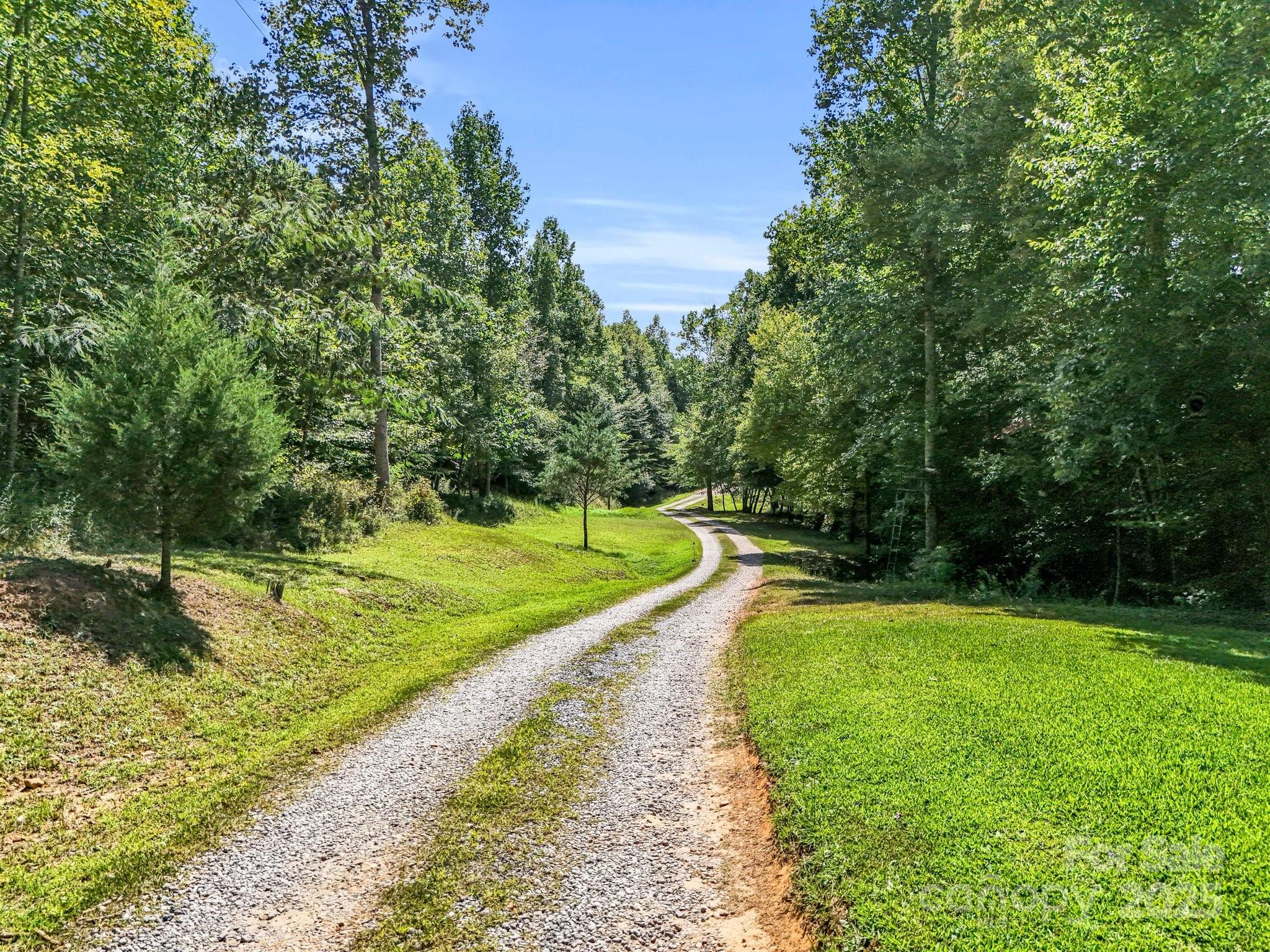 282 Reagan Lane Bostic, NC 28018 - Photo 27 of 34 a view of a swimming pool with a yard